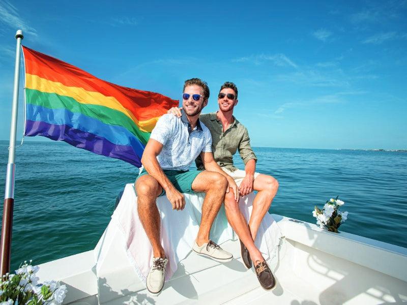 LGBTQ pride couple on boat charter