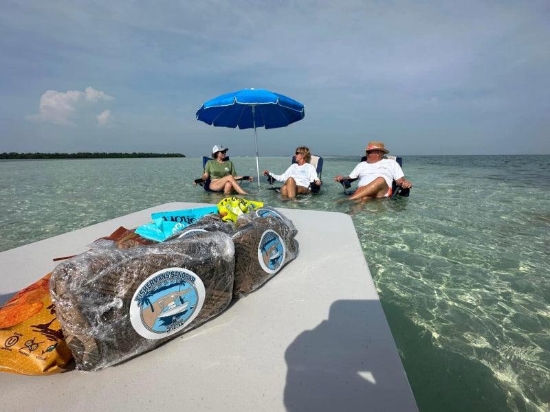 lunch package on table in water with people in ocean