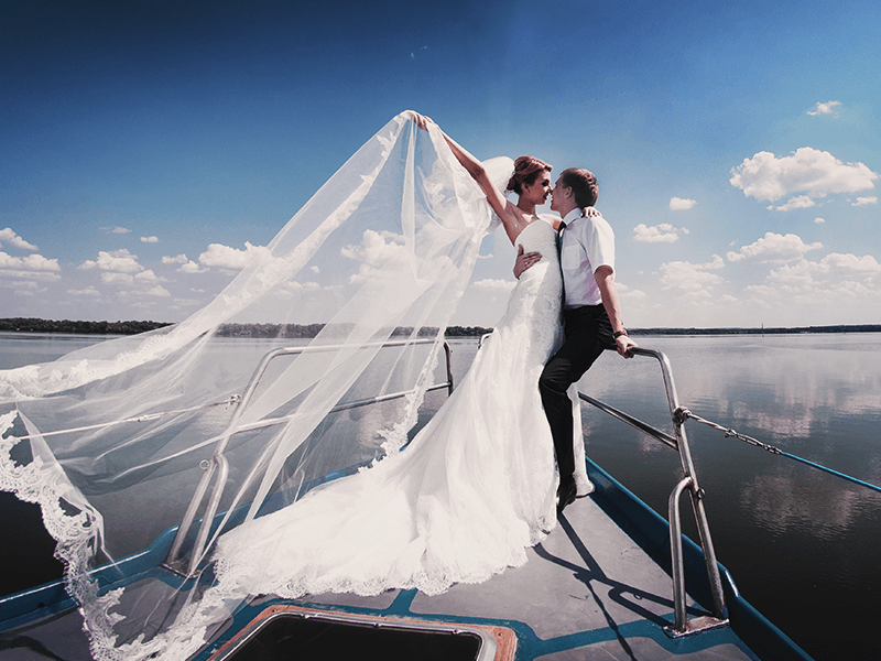 bride and groom on boat charter