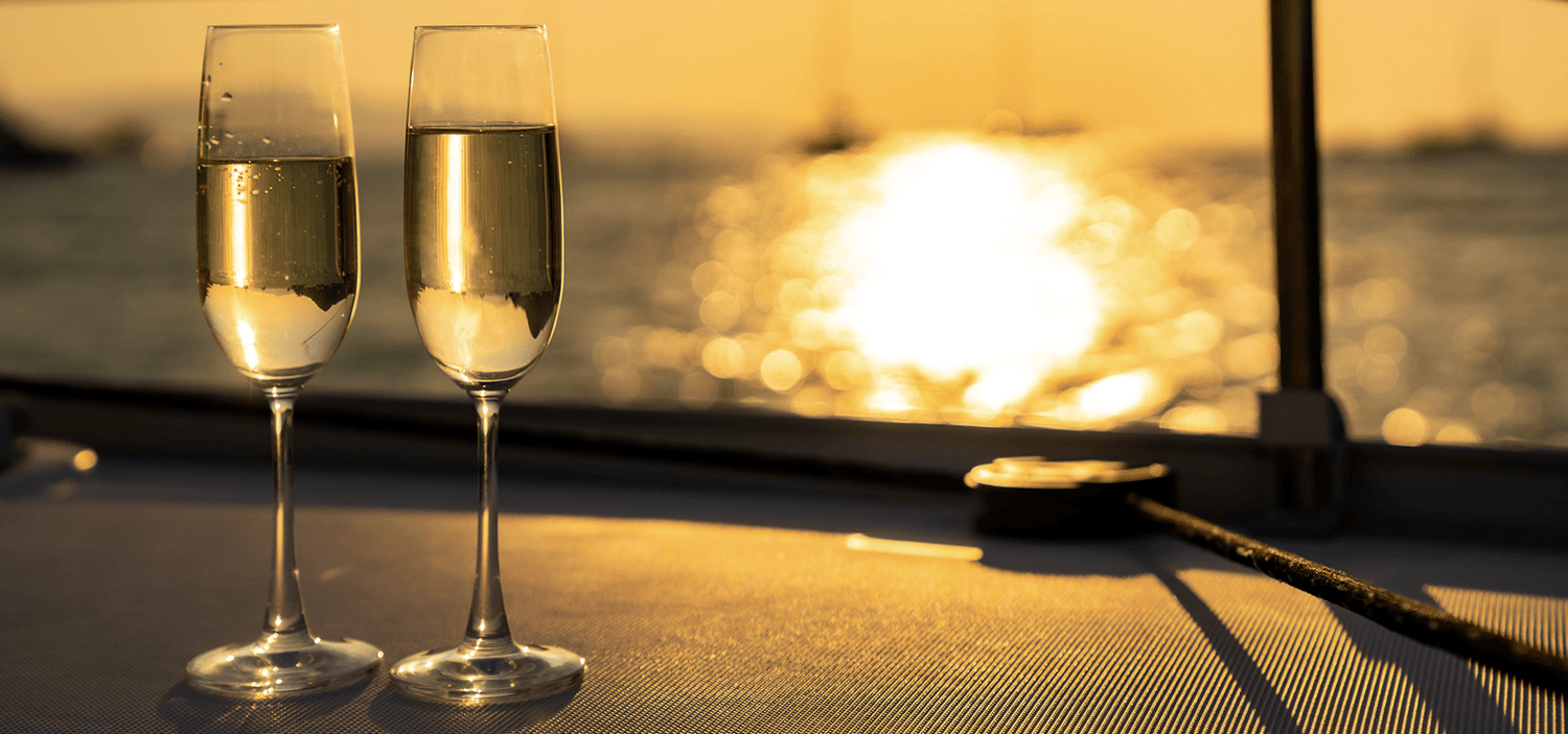 champagne by the sunset from yacht charter