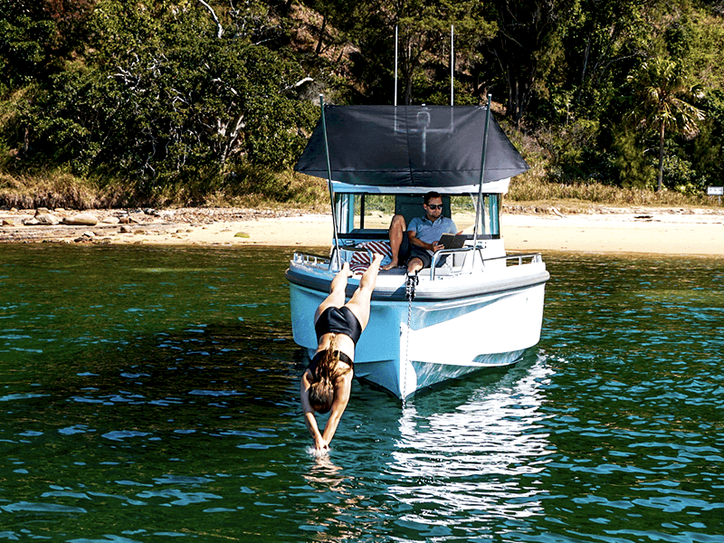 axopar 37 xc cross cabin boat woman diving into water