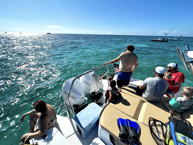 family on boat charter for snorkeling tour