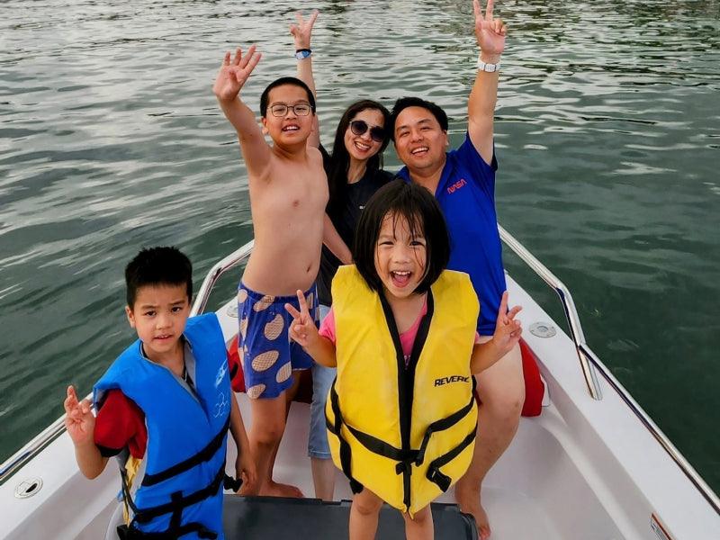 family on boat charter