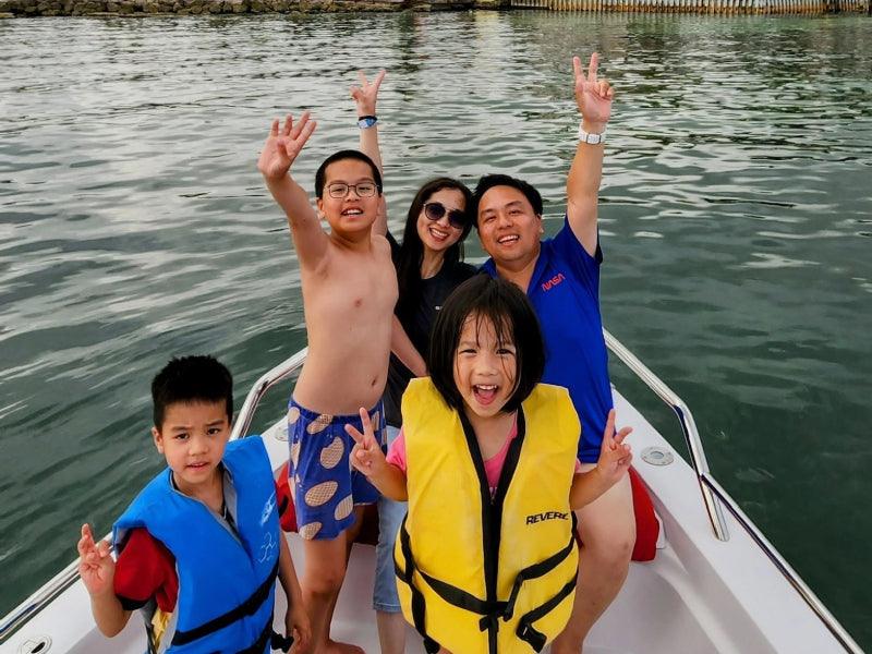 family on boat charter