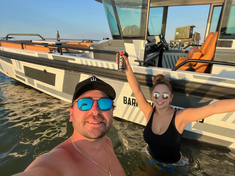couple by charter boat in ocean