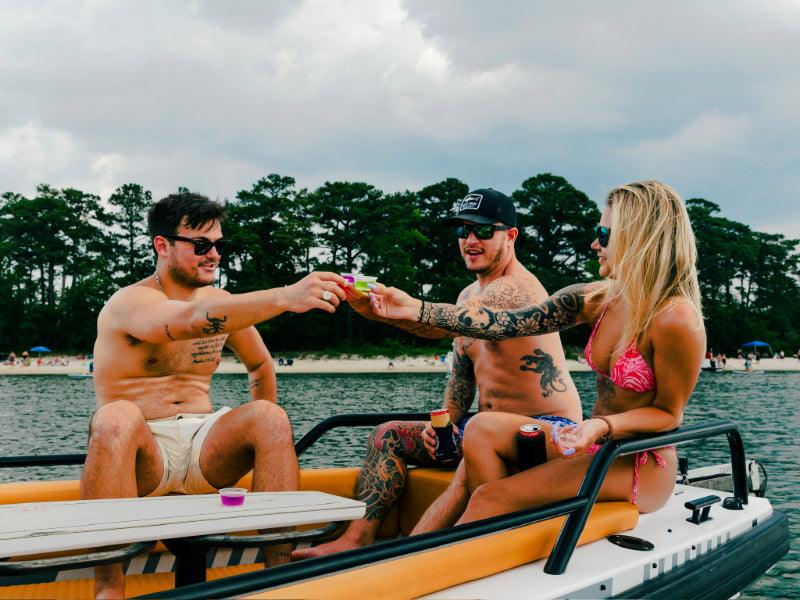three people drinking on charter boat