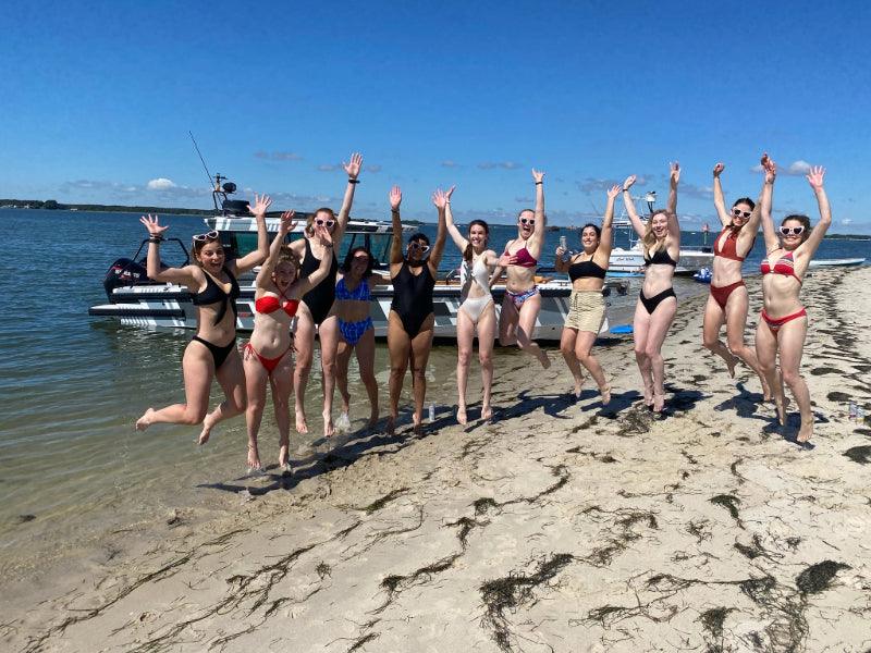 party group on sandbar for boat charter