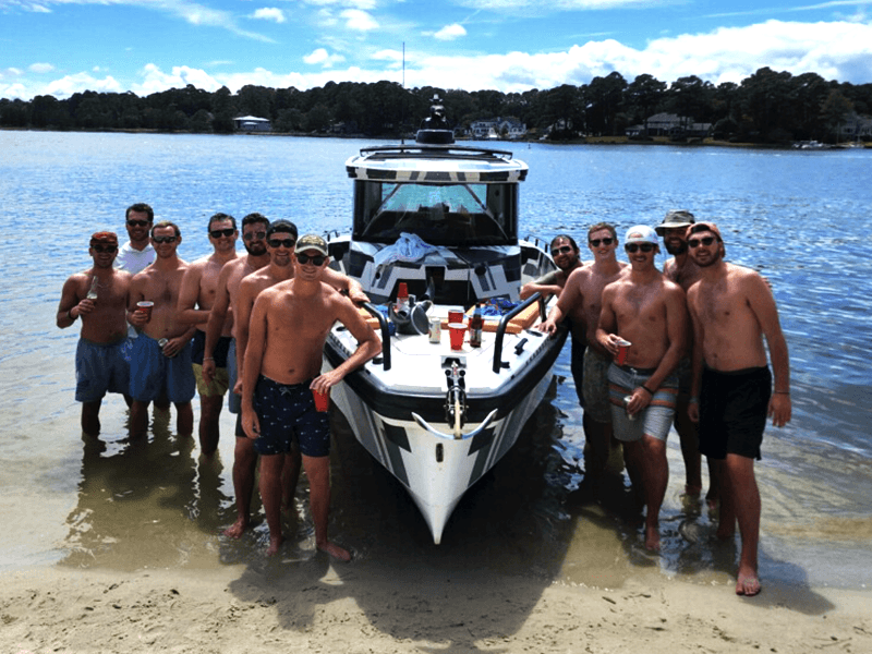 frat party group on boat charter by sandbar Virginia Beach