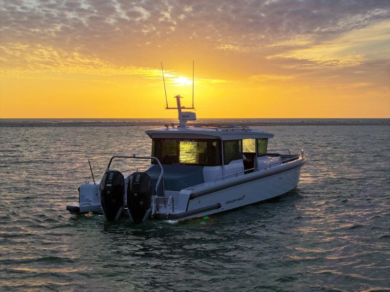 boat tour watching sunset by water