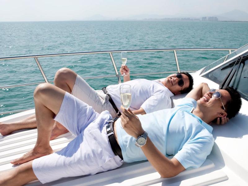 friends with drinks on boat charter