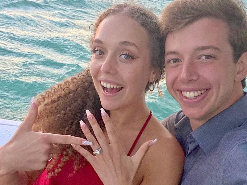 engaged couple on tour boat charter